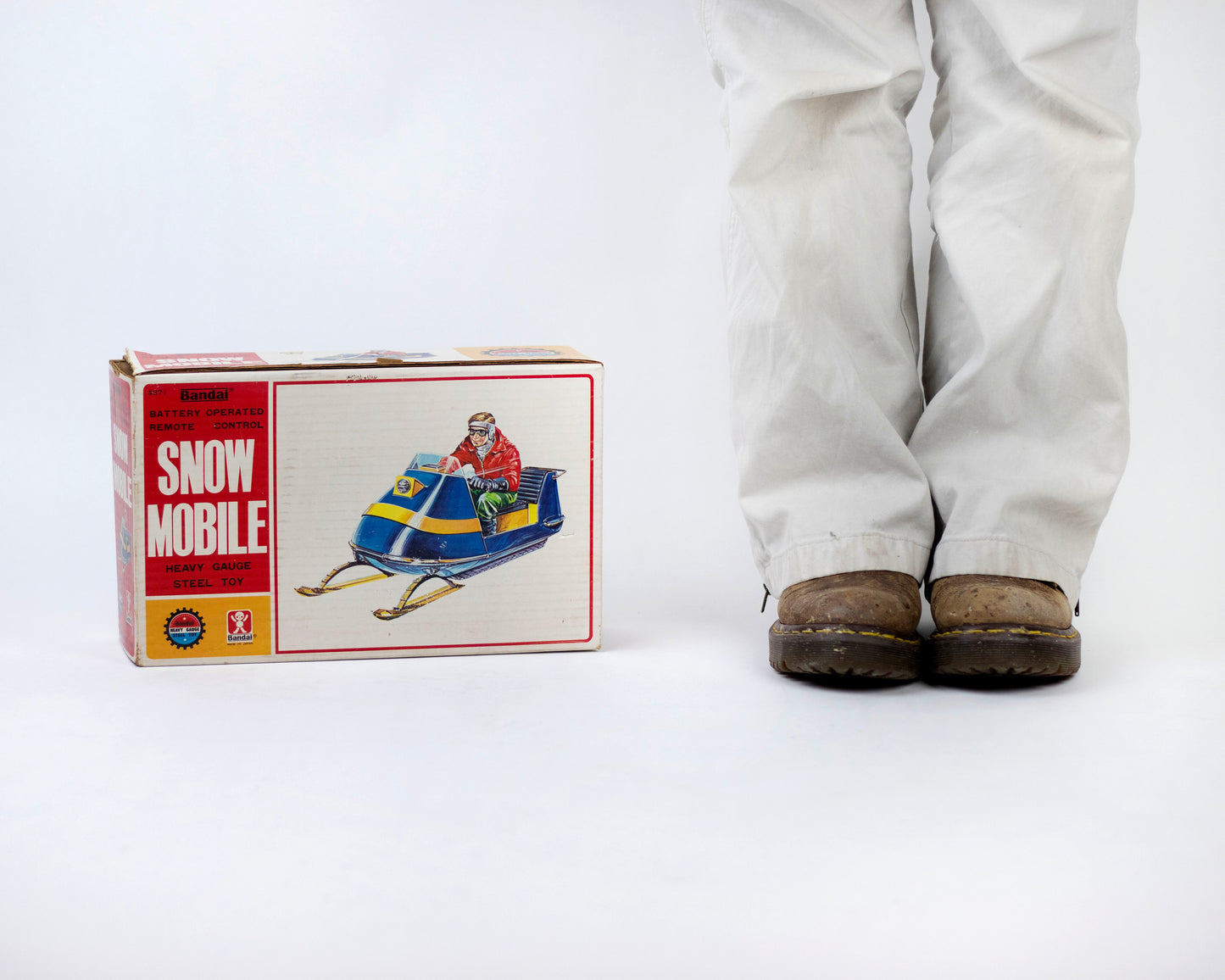 VINTAGE 1970S BANDAI BATTERY-OPERATED SNOWMOBILE TOY WITH BOX