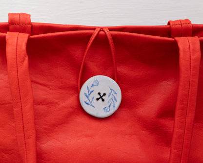 LEATHER PURSE WITH CERAMIC BUTTON (ED. 3/7)