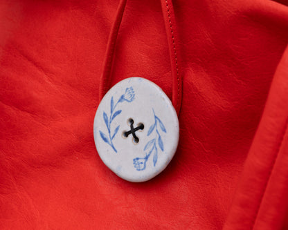 LEATHER PURSE WITH CERAMIC BUTTON (ED. 3/7)