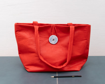 LEATHER PURSE WITH CERAMIC BUTTON (ED. 3/7)