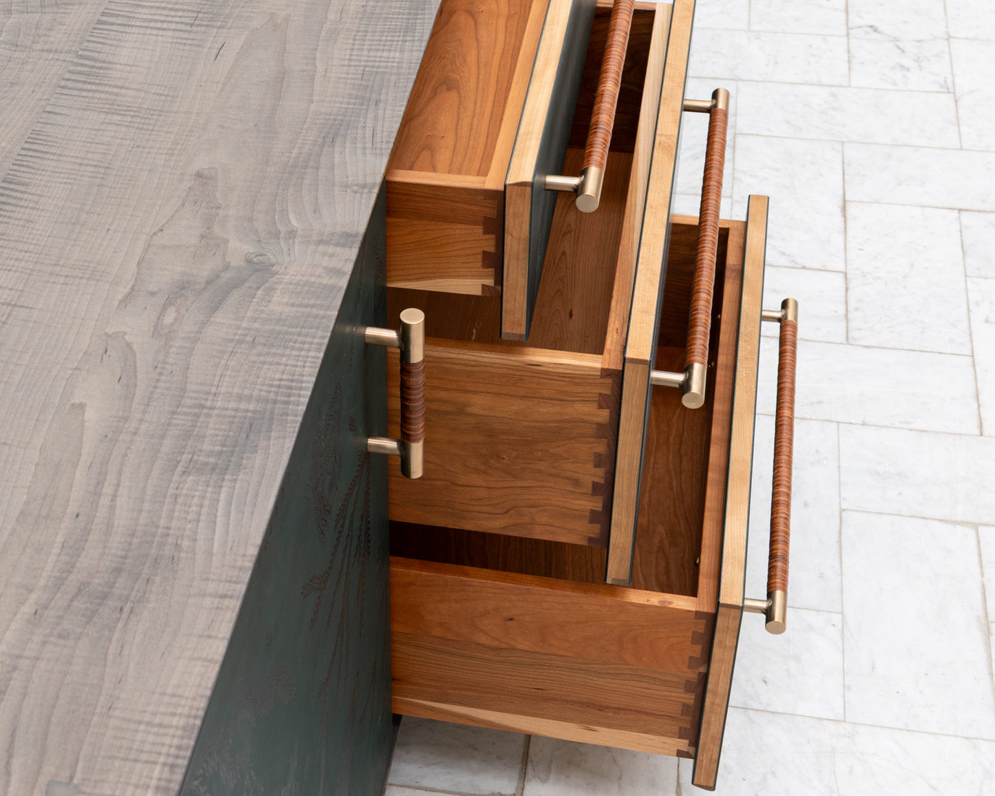 TATTOOED MAPPER BUREAU - 95" L, OXIDIZED OIL TIGER MAPLE EXTERIOR, POND LEATHER FACES
