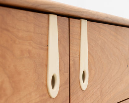 CAYESS DRESSER - 61" L, CHERRY EXTERIOR AND FACES, BLEACHED MAPLE PULLS