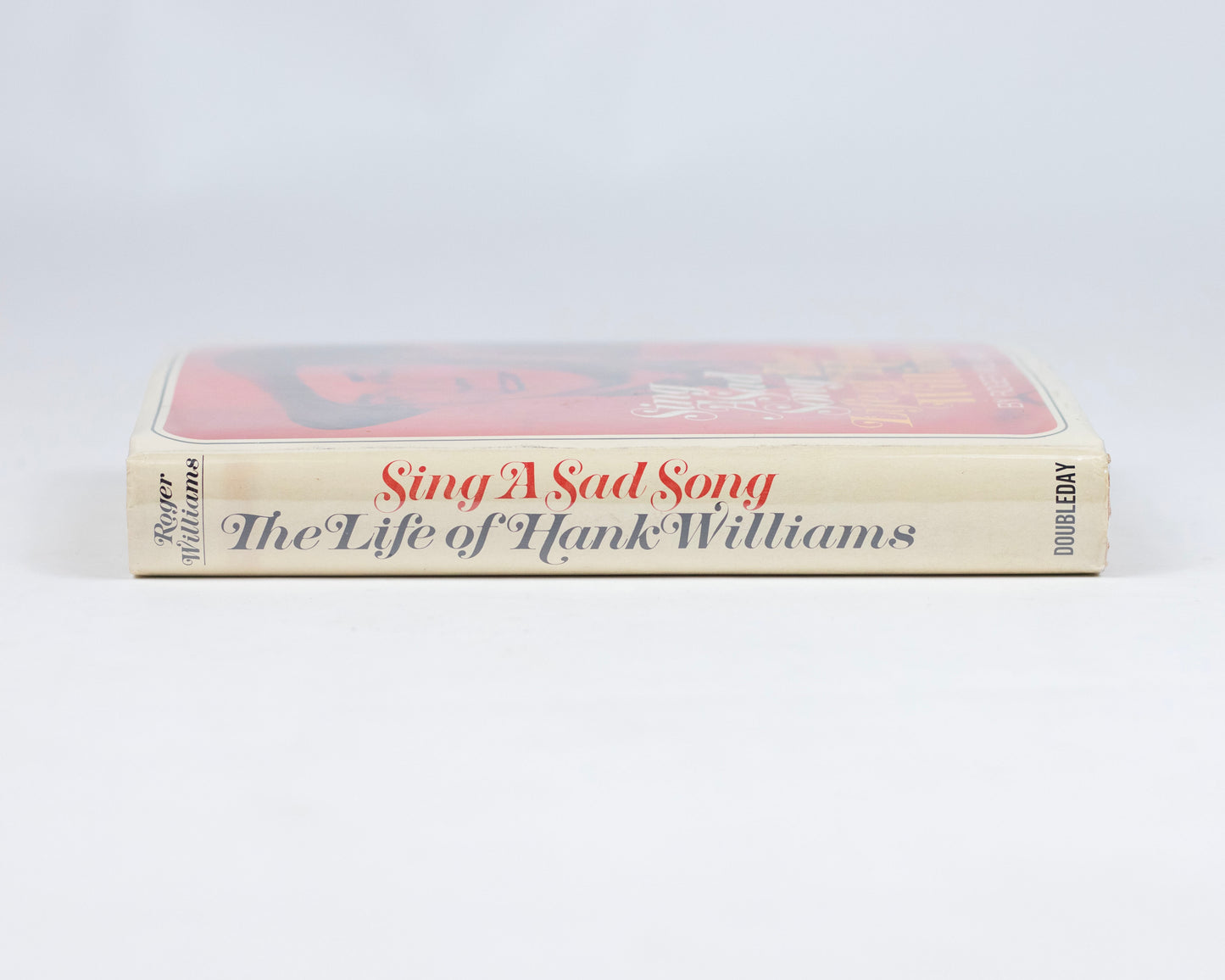VINTAGE FIRST EDITION COPY OF "SING A SAD SONG: THE LIFE OF HANK WILLIAMS" BY ROGER WILLIAMS