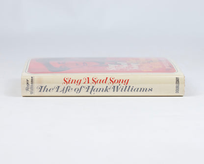 VINTAGE FIRST EDITION COPY OF "SING A SAD SONG: THE LIFE OF HANK WILLIAMS" BY ROGER WILLIAMS